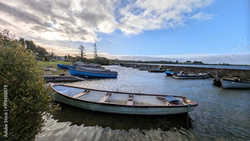 Obraz na płótnie Old wooden fishing boats in Corrib lake at Annaghdown pier, county Galway, Ireland, nature background w salonie