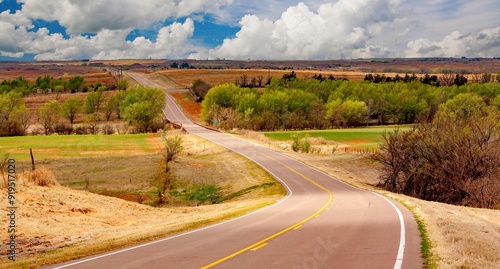 A highway traversing an agriculture area in the Oklahoma panhandle.