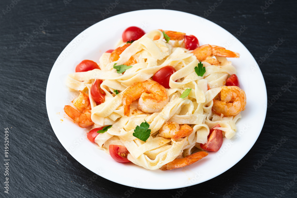 Italian pasta with shrimps , parmesan and tomatoes Italian pasta with shrimps , parmesan and tomatoes