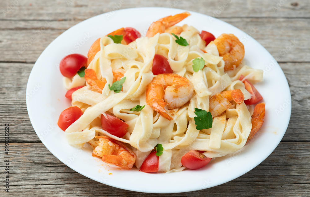 Italian pasta with shrimps , parmesan and tomatoes Italian pasta with shrimps , parmesan and tomatoes