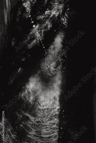 Waters with lights and shadows, artistic photography in black and white