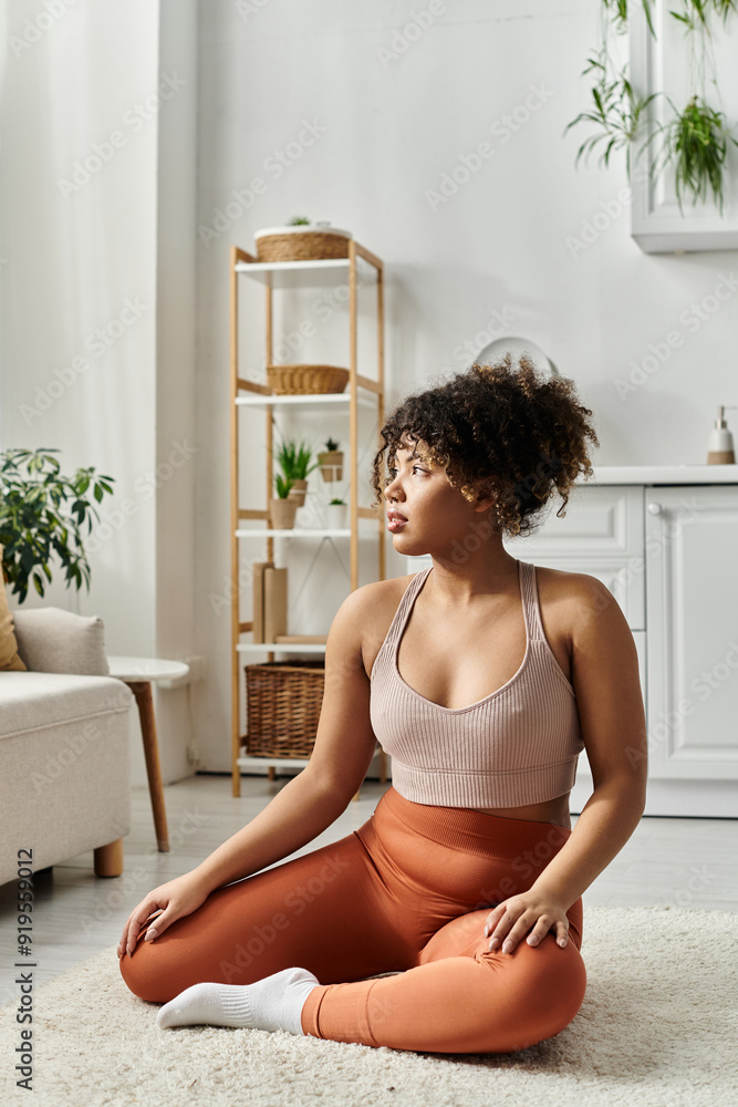 A young woman enjoys a moment of tranquility in her stylish living room. A young woman enjoys a moment of tranquility in her stylish living room.