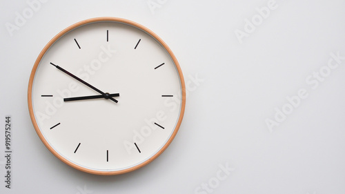 Minimalist wooden Wall Clock on White Wooden Surface with Space for Text – Time Set at 20.50, 08.50