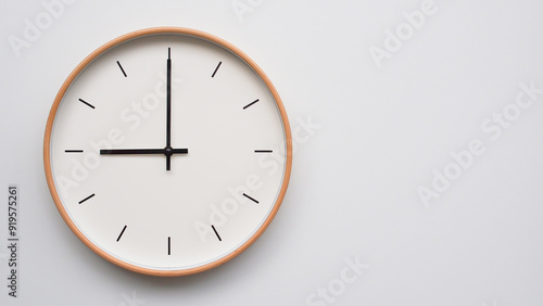 Minimalist wooden Wall Clock on White Wooden Surface with Space for Text – Time Set at 21.00, 09.00