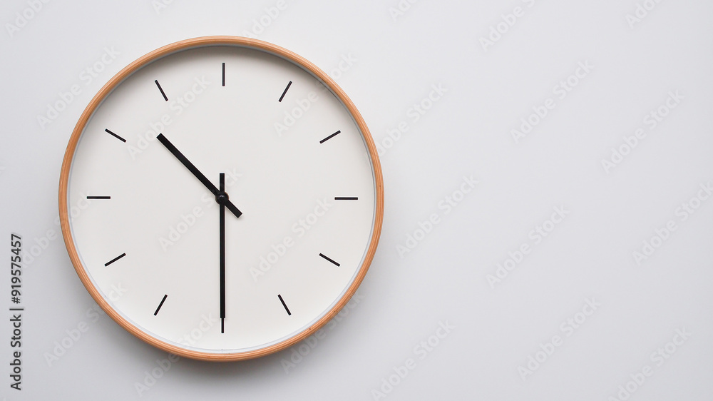 Minimalist wooden Wall Clock on White Wooden Surface with Space for Text – Time Set at 10.30, 22.30