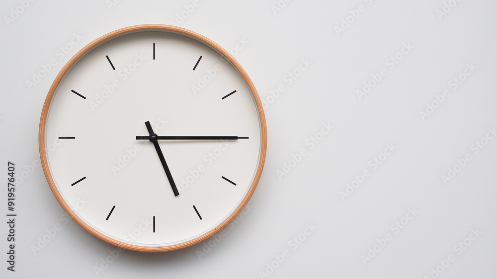 Minimalist wooden Wall Clock on White Wooden Surface with Space for Text – Time Set at 17.15/05.15 Minimalist wooden Wall Clock on White Wooden Surface with Space for Text – Time Set at 17.15/05.15