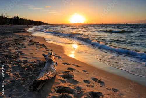 Fototapeta Naklejka Na Ścianę i Meble -  Sunset over the Baltic Sea beach in Gorki Zachodnie, Gdansk. Poland
