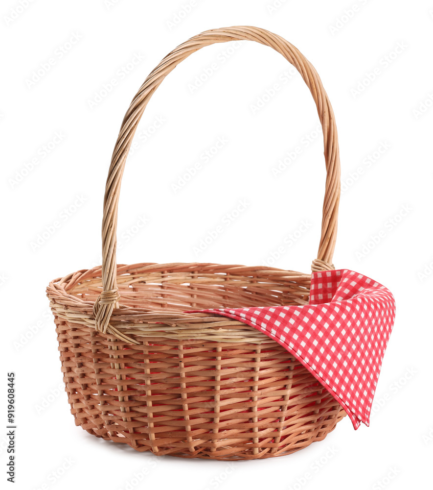 One picnic wicker basket with checkered napkin isolated on white One picnic wicker basket with checkered napkin isolated on white