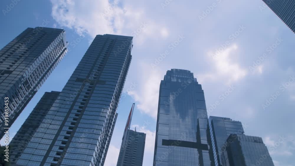 Office tall building. Low angle view of skyscrapers office building in central business district with blue sky Office tall building. Low angle view of skyscrapers office building in central business district with blue sky