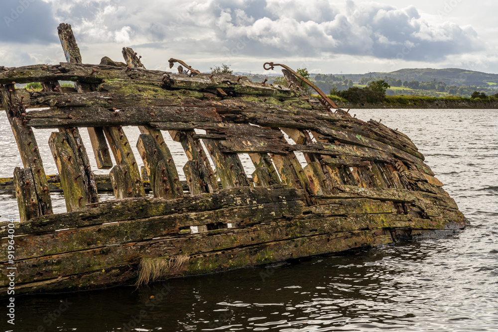 A shipwreck on the banks of the River Clyde in Bowling, Scotland, UK A shipwreck on the banks of the River Clyde in Bowling, Scotland, UK