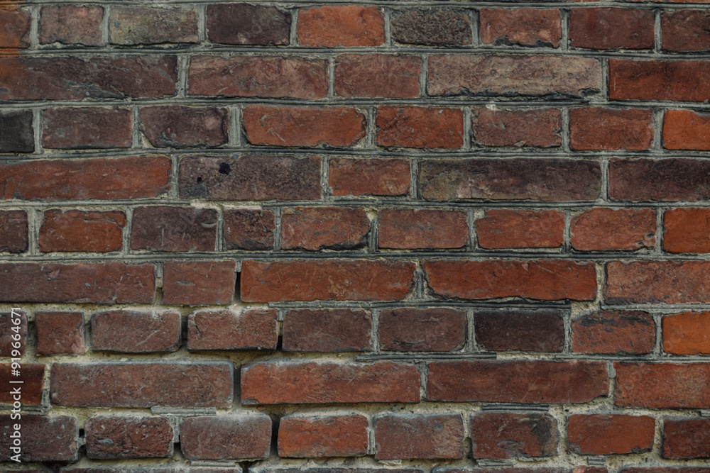 A brick wall with a few missing bricks A brick wall with a few missing bricks
