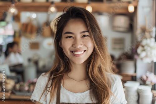 Wallpaper Mural Portrait of a smiling young Asian woman small business owner Torontodigital.ca