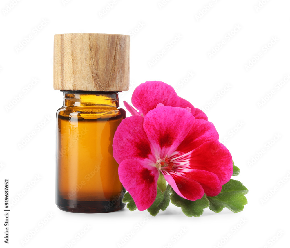 Geranium essential oil in bottle and beautiful flowers isolated on white Geranium essential oil in bottle and beautiful flowers isolated on white