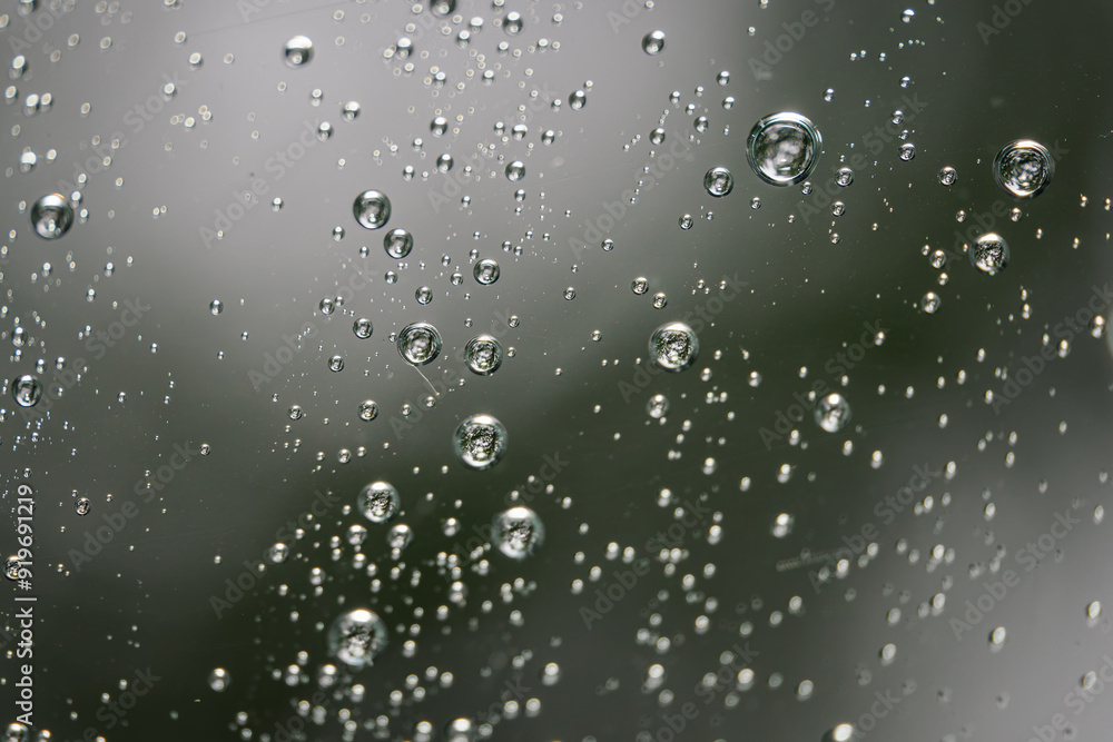 Raindrops on glass in detail. Raindrops on glass in detail.