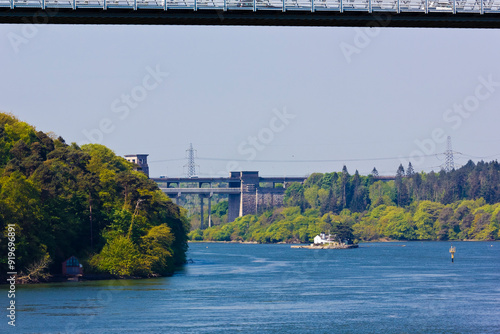 A summertime scene along the Menai Strait, featuring the Grade II Listed Britannia Bridge in the distance, Gwynedd, North Wales photo