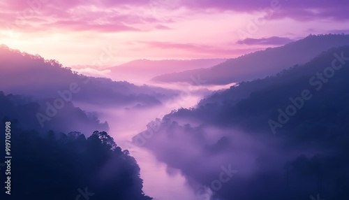 River Flowing Through Misty Valley at Dawn