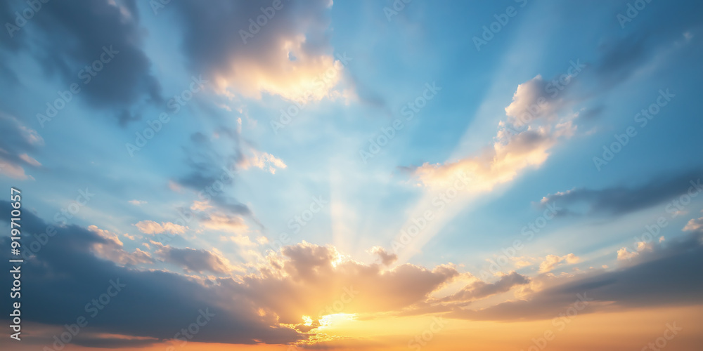 Golden sunset with clouds and sun rays in blue sky. Golden sunset with clouds and sun rays in blue sky.