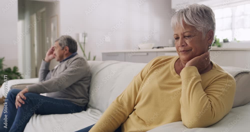 Unhappy, arguing and depressed senior couple upset and ignoring each other while sitting on the couch after a fight at home. Angry husband and wife worried about financial problems during retirement Unhappy, arguing and depressed senior couple upset and ignoring each other while sitting on the couch after a fight at home. Angry husband and wife worried about financial problems during retirement