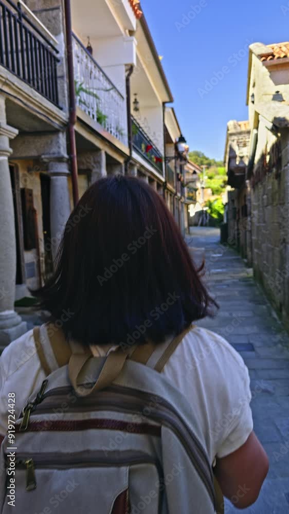 Traveler Walking Through Historic Village Stree Traveler Walking Through Historic Village Stree