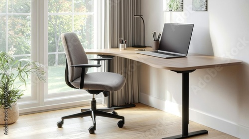 a desk with laptop and plant