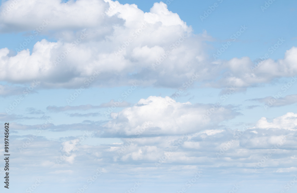 Sky replacement white puffy clouds against very light blue sky Sky replacement white puffy clouds against very light blue sky