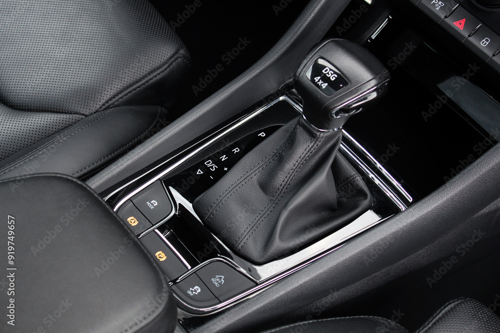 DSG Gear lever close up. DSG transmission. DSG gearbox. Modern Automatic Transmission DSG in Car. Luxury car interior with leather car interior. DSG Gear lever close up. DSG transmission. DSG gearbox. Modern Automatic Transmission DSG in Car. Luxury car interior with leather car interior.
