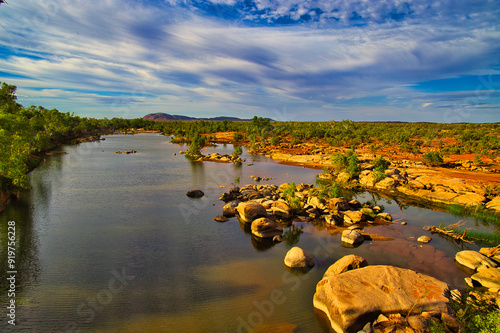 The Ashburton River at Nanutarra, Pilbara region, Western Australia. The red earth of the outback lights up in the setting sun
 photo