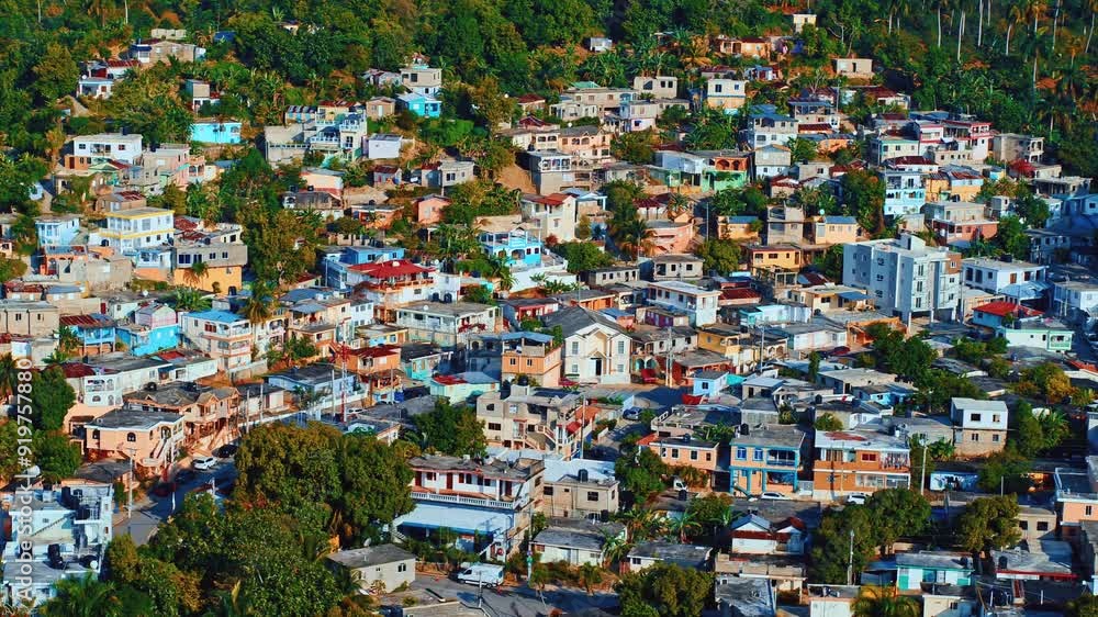 Small town with mountain tropical landscape and nature park in the background. Aerial view of old town at dawn. Architecture of old city in Latin America. Small streets and gardens around buildings. Small town with mountain tropical landscape and nature park in the background. Aerial view of old town at dawn. Architecture of old city in Latin America. Small streets and gardens around buildings.