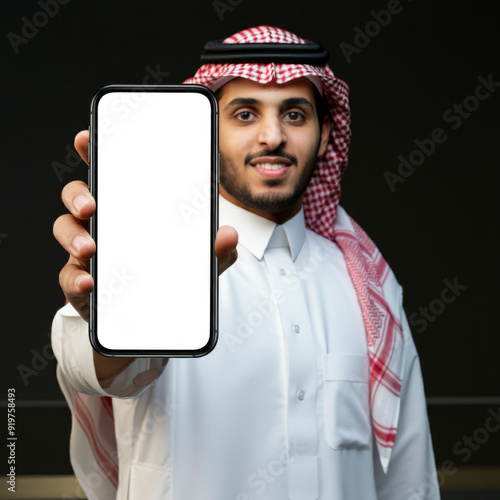 saudi man holding smart phone with his hand showing the screen to camera, Mockup a isolated for Infographic Business web site design app
