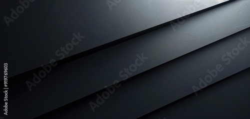 Abstract dark grey textured background with subtle shadow.