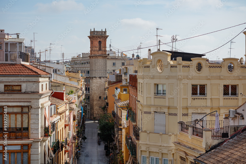 Valencia's Serrans street and Saint Bartolome Tower in summer Valencia's Serrans street and Saint Bartolome Tower in summer
