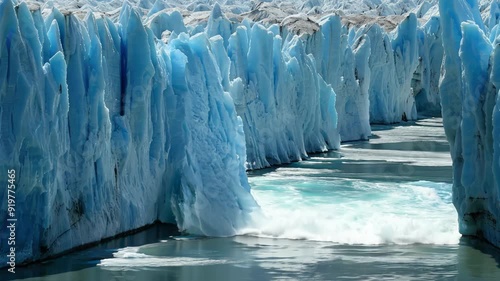 Glacier ice calving into the ocean, climate change concept, reminder of the fragility of Earth's ecosystems and the urgent need for climate action