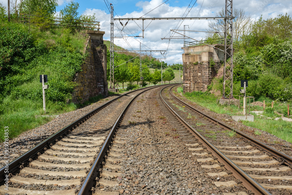 Railway outdoors on beautiful summer day. Industrial landscape with rails and railway.