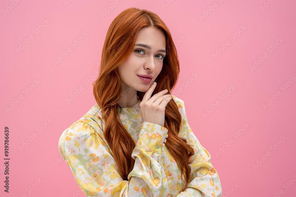 Long-haired pretty woman looking into camera with a thoughtful view' Long-haired pretty woman looking into camera with a thoughtful view'