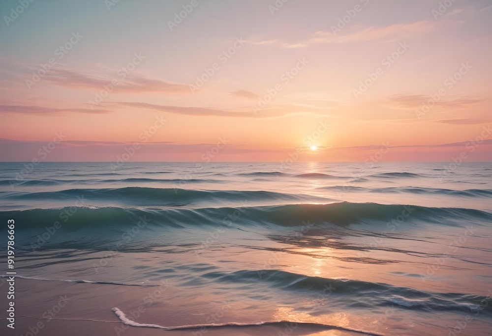Obraz premium A serene ocean landscape with calm, rippling waves reflecting the warm, pastel-colored sky and bright sun in the distance