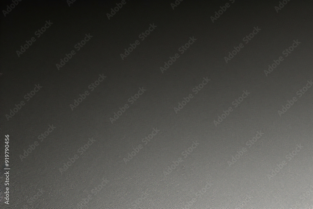 Black background made of real, shiny black paper covered with foil, illuminated by a soft light from above.