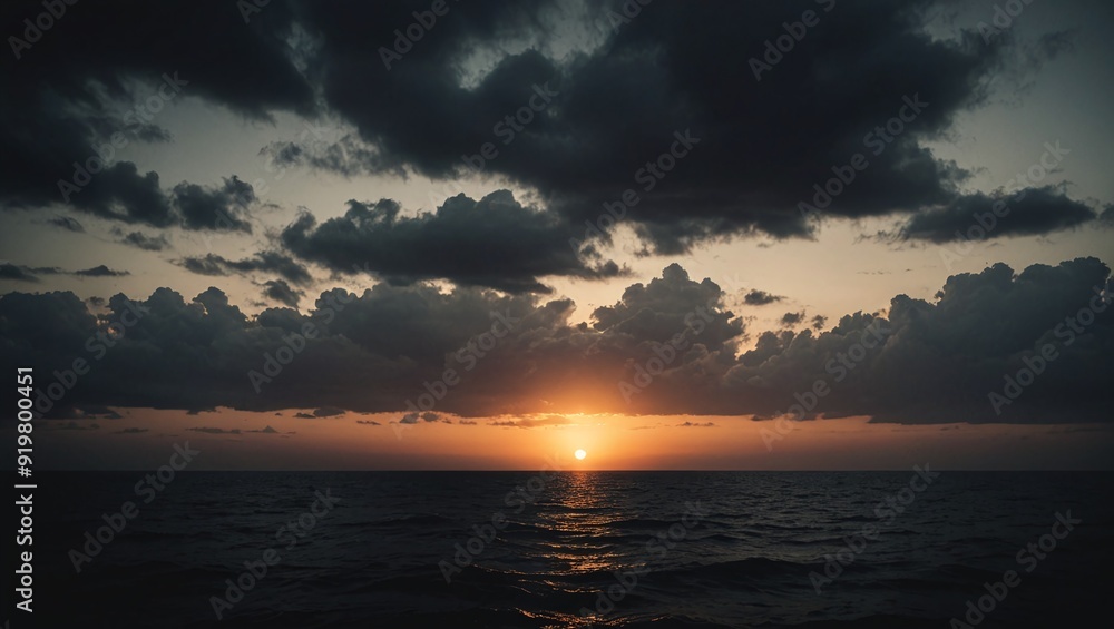 Obraz premium Dramatic Sunset Silhouette with Moody Sky Background