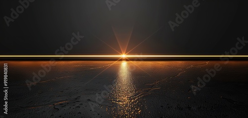 Sunset reflected on water with a dark sky.