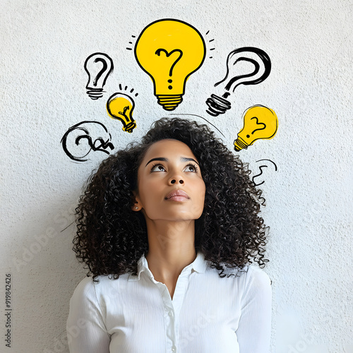 A thoughtful woman with curly black hair, dressed in a white shirt, looking upwards with a contemplative expression.