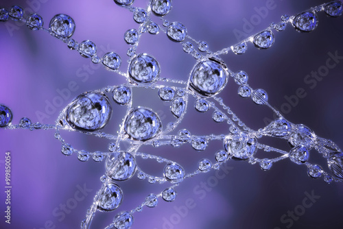 Dew droplets on a spider web, with beautiful abstract reflections, captured in macro photography.