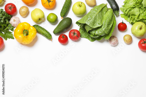 Fototapeta Naklejka Na Ścianę i Meble -  Healthy vegetarian food. Different vegetables and fruits on white background, flat lay. Space for text