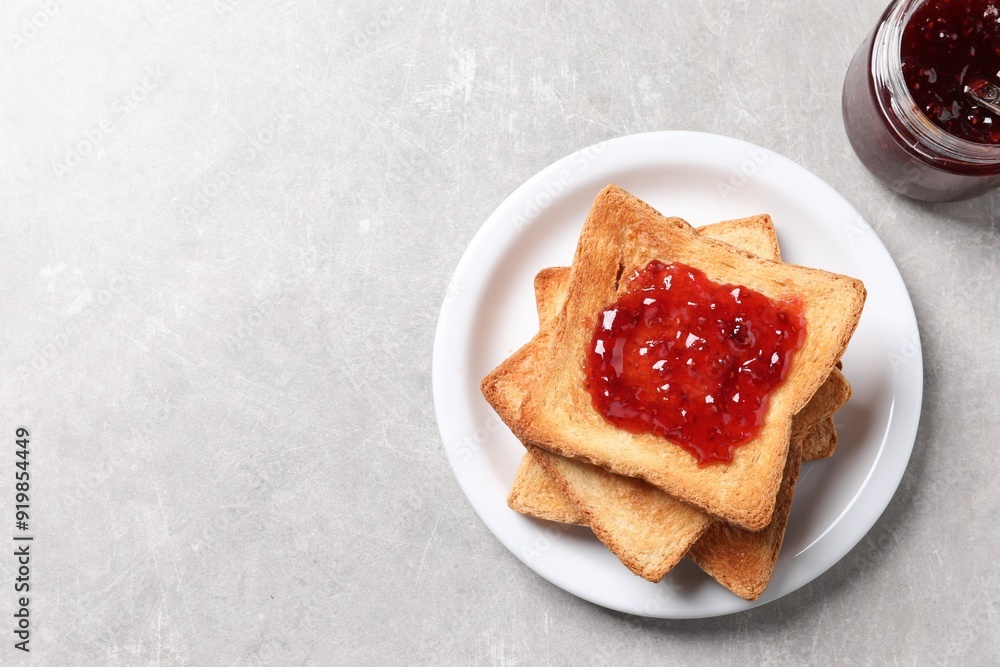 Delicious toasts with jam on light table, top view. Space for text