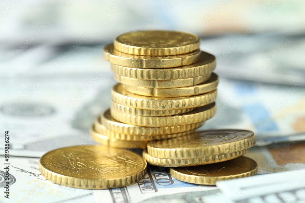 Many euro coins on dollar banknotes, closeup Many euro coins on dollar banknotes, closeup