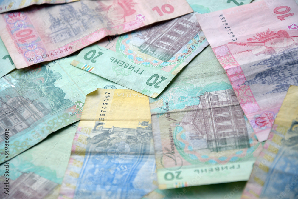 Processed collage of Ukrainian Hryvnia UAH bills banknotes texture. Background for banner Processed collage of Ukrainian Hryvnia UAH bills banknotes texture. Background for banner