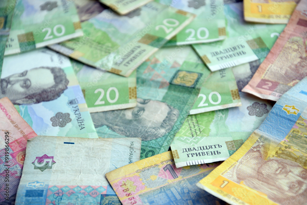 Processed collage of Ukrainian Hryvnia UAH bills banknotes texture. Background for banner Processed collage of Ukrainian Hryvnia UAH bills banknotes texture. Background for banner