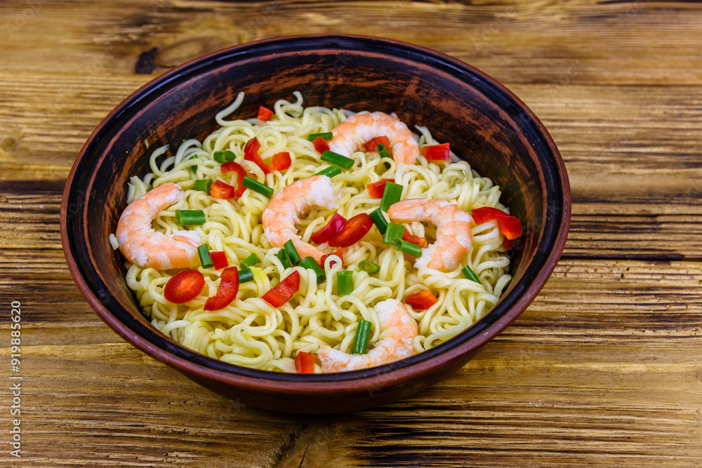 Instant noodle with shrimps, red pepper and green onion in a ceramic bowl. Japanese food Instant noodle with shrimps, red pepper and green onion in a ceramic bowl. Japanese food