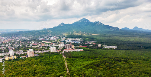 Landscape of Pyatigorsk, aerial view of city on background of Beshtau Mountain, Stavropol Krai, Russia. Scenic panorama of town in Mineral Waters. Concept of nature, travel, summer photo