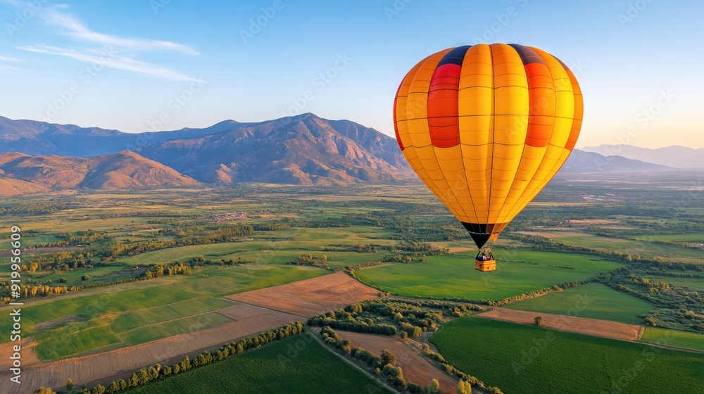 Fototapeta premium Golden Sunrise Balloon Adventure Over Scenic Valley