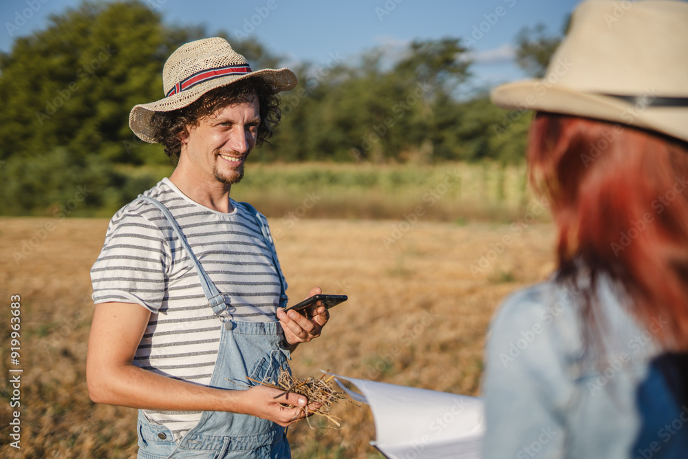 Fototapeta premium man farmer in the take a photo of example with mobile phone