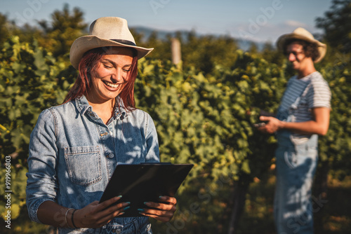 woman farmer work and analysis quality on clipboard in the vineyard